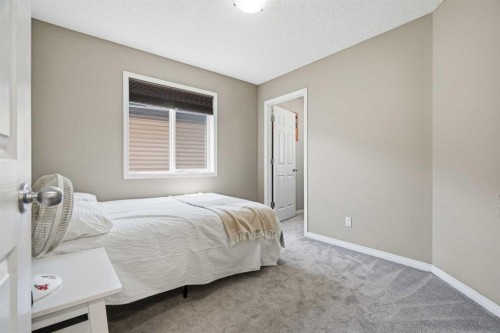 379 Cimarron Boulevard, Okotoks, AB - Indoor Photo Showing Bedroom