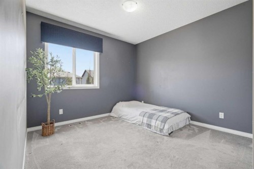 379 Cimarron Boulevard, Okotoks, AB - Indoor Photo Showing Bedroom