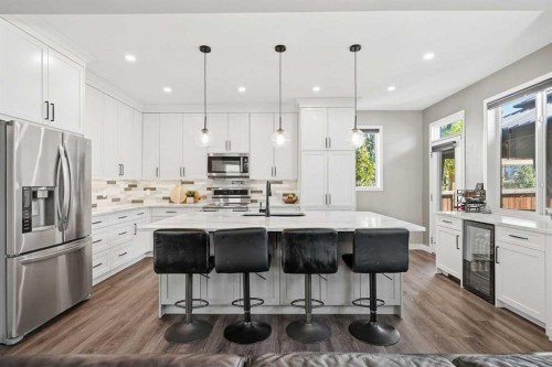 379 Cimarron Boulevard, Okotoks, AB - Indoor Photo Showing Kitchen With Upgraded Kitchen