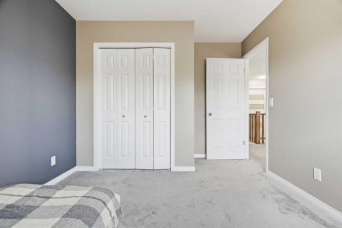 379 Cimarron Boulevard, Okotoks, AB - Indoor Photo Showing Bedroom