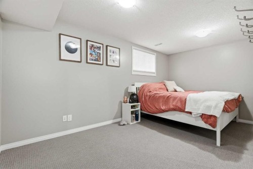 379 Cimarron Boulevard, Okotoks, AB - Indoor Photo Showing Bedroom