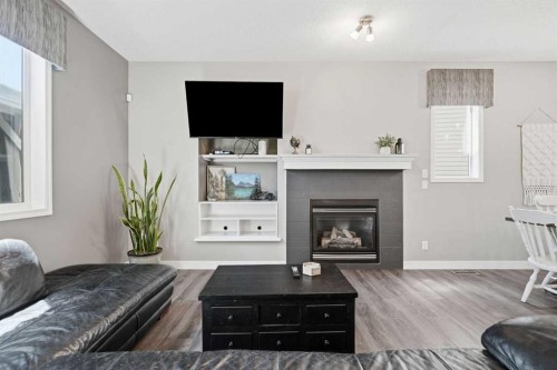 379 Cimarron Boulevard, Okotoks, AB - Indoor Photo Showing Living Room With Fireplace