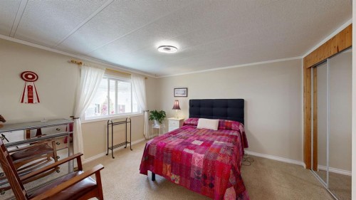 304 Slade Drive, Nanton, AB - Indoor Photo Showing Bedroom