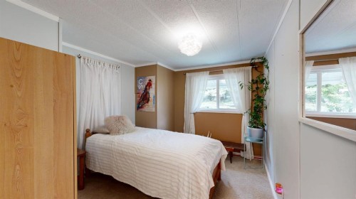 304 Slade Drive, Nanton, AB - Indoor Photo Showing Bedroom