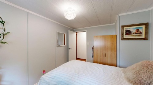 304 Slade Drive, Nanton, AB - Indoor Photo Showing Bedroom