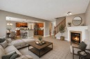 249 Springmere Way, Chestermere, AB  - Indoor Photo Showing Living Room With Fireplace 