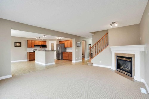 249 Springmere Way, Chestermere, AB - Indoor Photo Showing Living Room With Fireplace