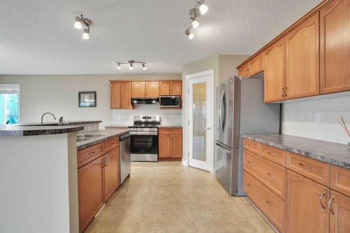 249 Springmere Way, Chestermere, AB - Indoor Photo Showing Kitchen With Double Sink