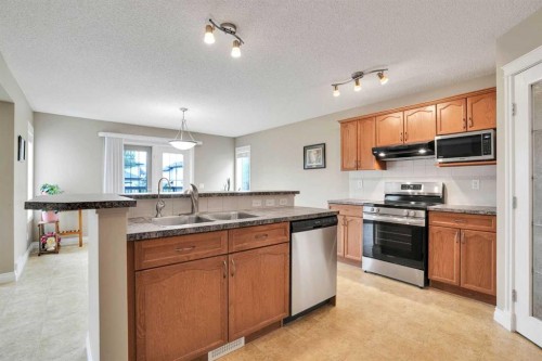 249 Springmere Way, Chestermere, AB - Indoor Photo Showing Kitchen With Double Sink