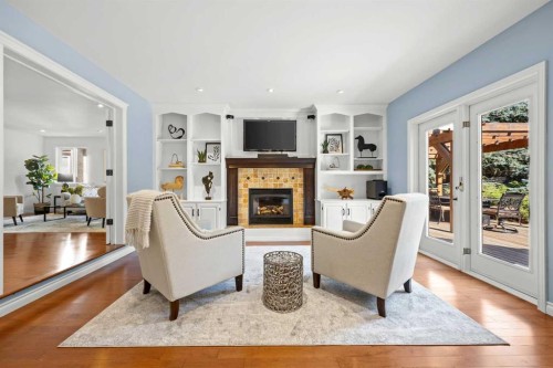 138 Scimitar Bay Nw, Calgary, AB - Indoor Photo Showing Living Room With Fireplace