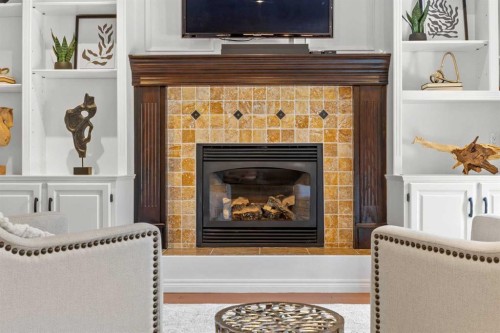 138 Scimitar Bay Nw, Calgary, AB - Indoor Photo Showing Living Room With Fireplace