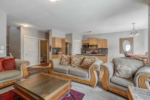 177 Cougartown Circle Sw, Calgary, AB - Indoor Photo Showing Living Room