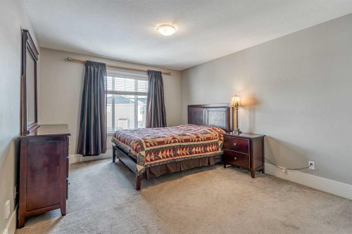 177 Cougartown Circle Sw, Calgary, AB - Indoor Photo Showing Bedroom