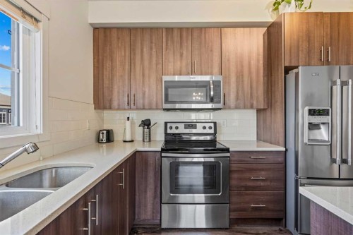 3417-215 Legacy Boulevard Se, Calgary, AB - Indoor Photo Showing Kitchen With Stainless Steel Kitchen With Double Sink