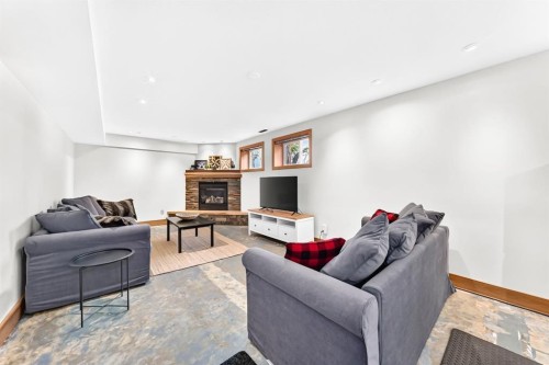 1009 15 Street, Canmore, AB - Indoor Photo Showing Living Room With Fireplace