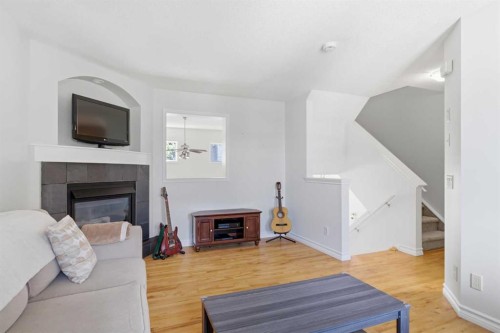 277 Inglewood Grove Se, Calgary, AB - Indoor Photo Showing Living Room With Fireplace