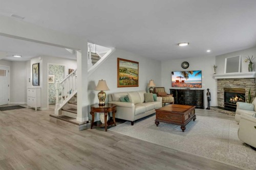 112 Hidden Vale Place Nw, Calgary, AB - Indoor Photo Showing Living Room With Fireplace