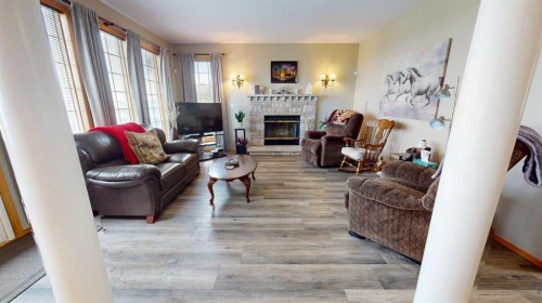 38323 Range Road 282, Rural Red Deer County, AB - Indoor Photo Showing Living Room With Fireplace