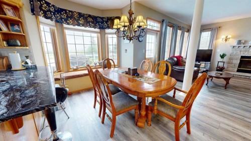 38323 Range Road 282, Rural Red Deer County, AB - Indoor Photo Showing Dining Room With Fireplace