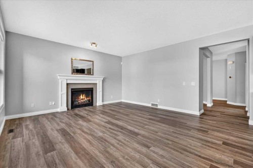51 Evansborough Road Nw, Calgary, AB - Indoor Photo Showing Living Room With Fireplace