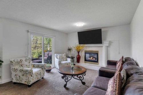 280140 Township Road 241A, Chestermere, AB - Indoor Photo Showing Living Room With Fireplace
