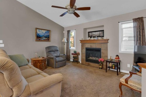 44 Ravenslea Crescent Se, Airdrie, AB - Indoor Photo Showing Living Room With Fireplace