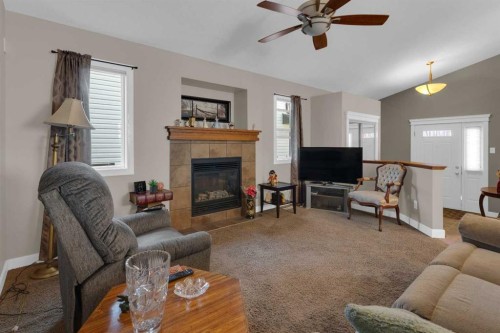 44 Ravenslea Crescent Se, Airdrie, AB - Indoor Photo Showing Living Room With Fireplace