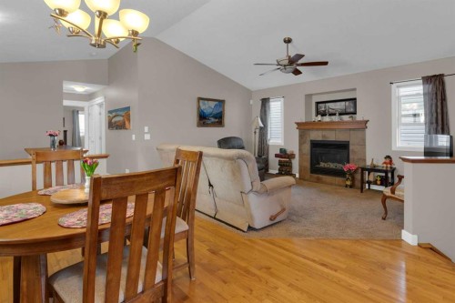 44 Ravenslea Crescent Se, Airdrie, AB - Indoor Photo Showing Dining Room With Fireplace