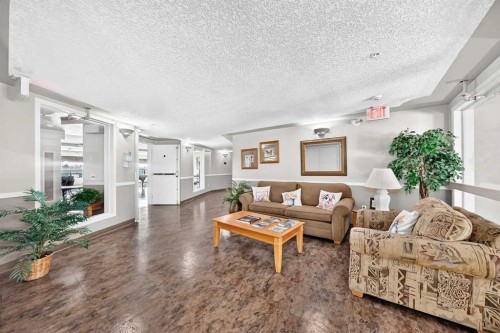 3425-3000 Millrise Point Sw, Calgary, AB - Indoor Photo Showing Living Room