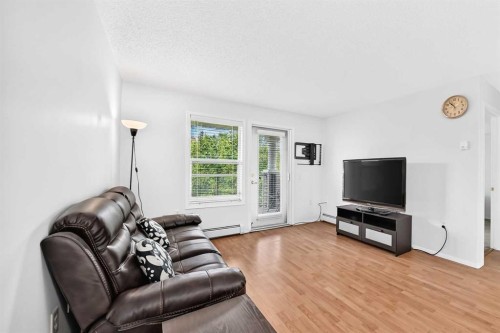 3425-3000 Millrise Point Sw, Calgary, AB - Indoor Photo Showing Living Room