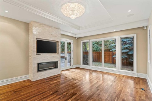 1020 Bel-Aire Drive Sw, Calgary, AB - Indoor Photo Showing Other Room With Fireplace