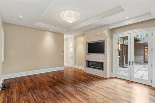 1020 Bel-Aire Drive Sw, Calgary, AB - Indoor Photo Showing Other Room With Fireplace