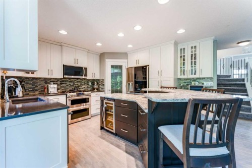 99 Springbluff Boulevard Sw, Calgary, AB - Indoor Photo Showing Kitchen With Upgraded Kitchen
