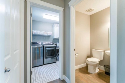 99 Springbluff Boulevard Sw, Calgary, AB - Indoor Photo Showing Laundry Room