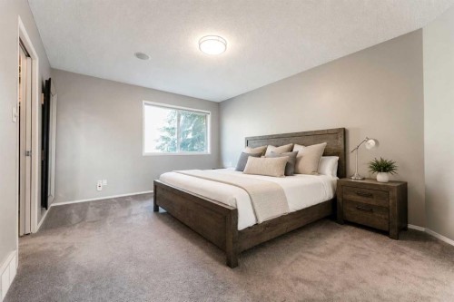 99 Springbluff Boulevard Sw, Calgary, AB - Indoor Photo Showing Bedroom