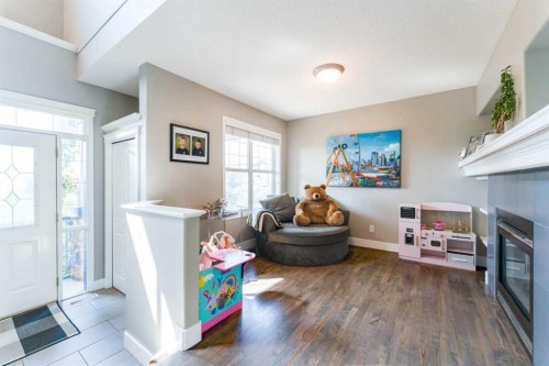 99 Springbluff Boulevard Sw, Calgary, AB - Indoor With Fireplace