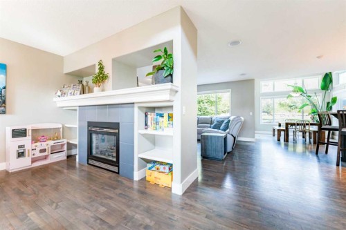 99 Springbluff Boulevard Sw, Calgary, AB - Indoor Photo Showing Living Room With Fireplace