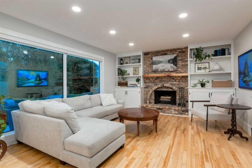 775 Strathcona Drive Sw, Calgary, AB - Indoor Photo Showing Living Room With Fireplace