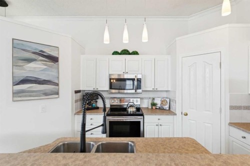 336 Mt Aberdeen Close Se, Calgary, AB - Indoor Photo Showing Kitchen With Double Sink