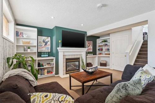 336 Mt Aberdeen Close Se, Calgary, AB - Indoor Photo Showing Living Room With Fireplace