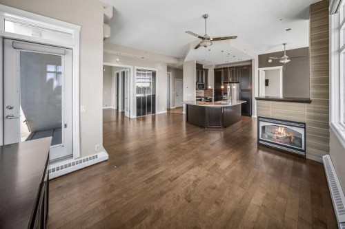619-950 Centre Avenue Ne, Calgary, AB - Indoor Photo Showing Other Room With Fireplace