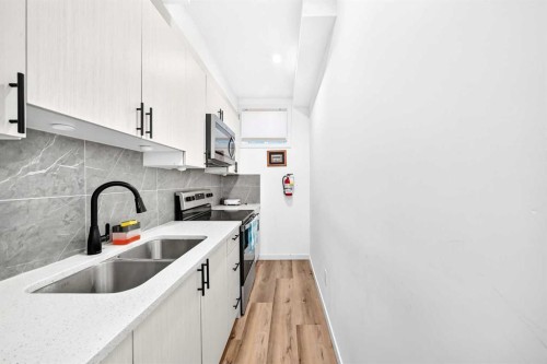 224 Corner Meadows Way, Calgary, AB - Indoor Photo Showing Kitchen With Double Sink With Upgraded Kitchen