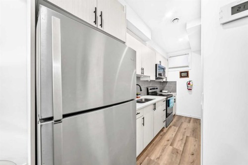 224 Corner Meadows Way, Calgary, AB - Indoor Photo Showing Kitchen With Double Sink