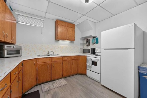 14 Rosetree Crescent Nw, Calgary, AB - Indoor Photo Showing Kitchen With Double Sink