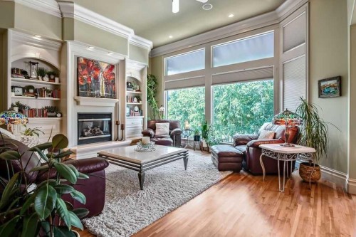 117 West Terrace Point, Cochrane, AB - Indoor Photo Showing Living Room With Fireplace
