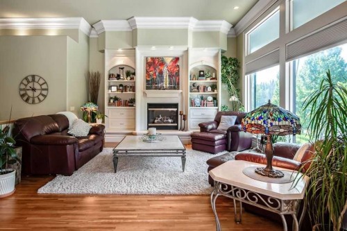 117 West Terrace Point, Cochrane, AB - Indoor Photo Showing Living Room With Fireplace