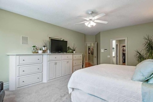 117 West Terrace Point, Cochrane, AB - Indoor Photo Showing Bedroom