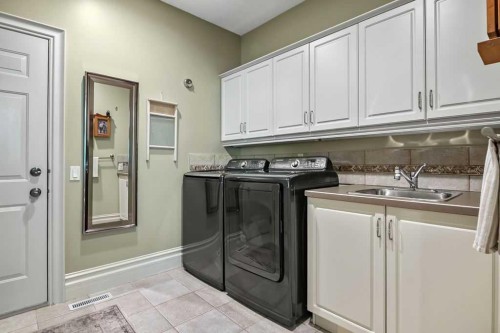 117 West Terrace Point, Cochrane, AB - Indoor Photo Showing Laundry Room