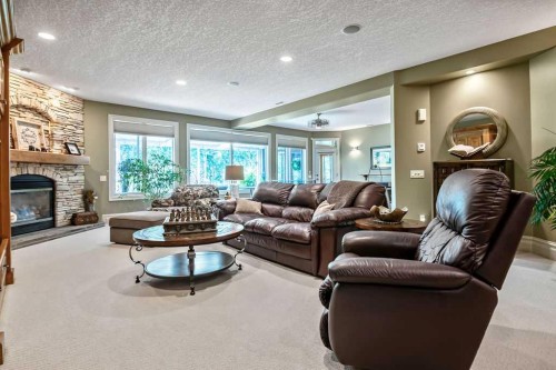 117 West Terrace Point, Cochrane, AB - Indoor Photo Showing Living Room With Fireplace