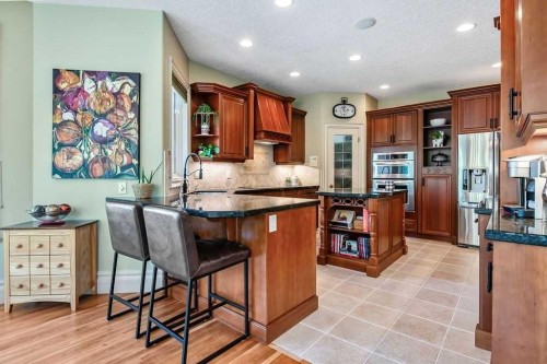 117 West Terrace Point, Cochrane, AB - Indoor Photo Showing Kitchen With Upgraded Kitchen